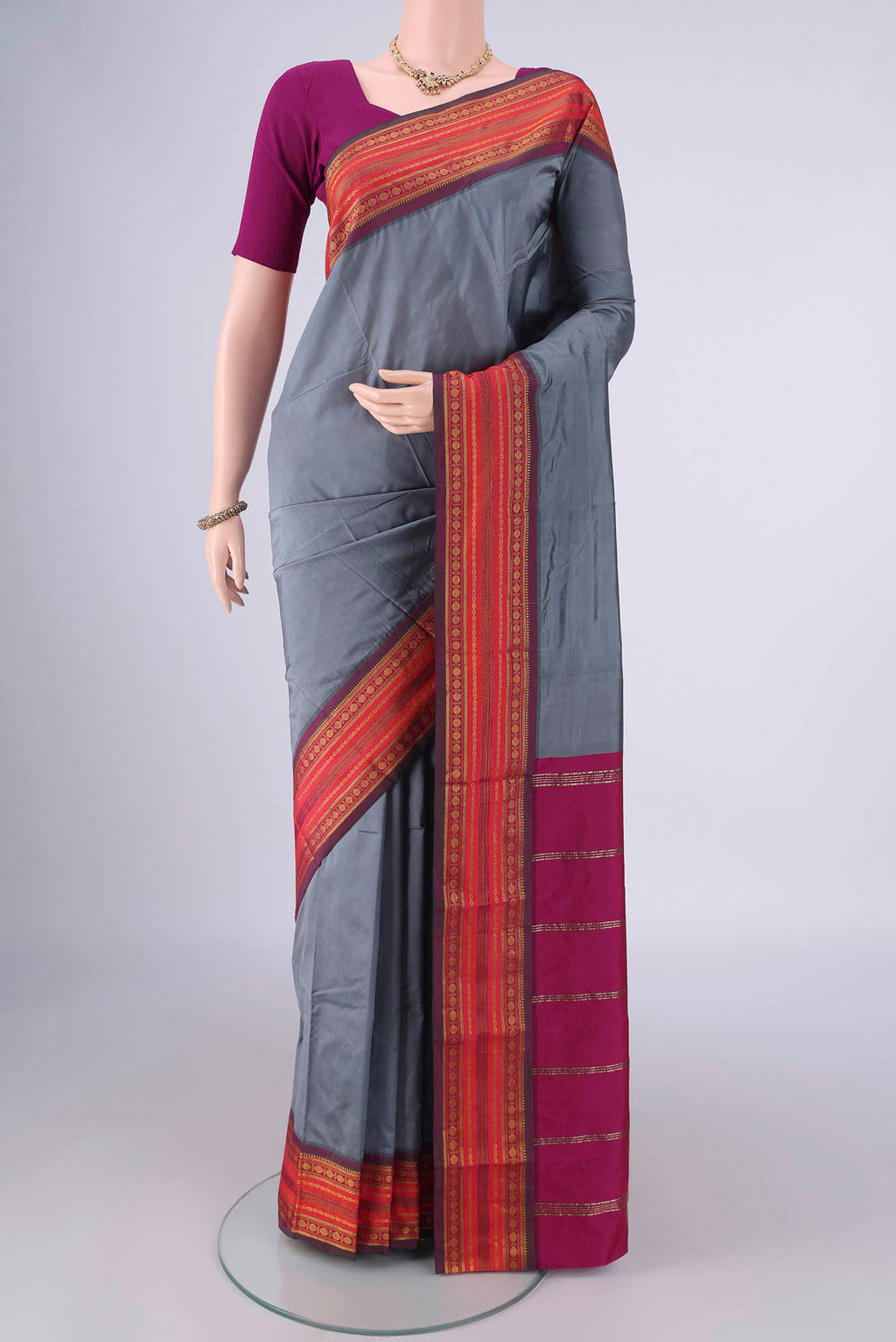 Grey Blended Bangalore Silk Saree with Plain Body and Zari Border.  displayed on a mannequin