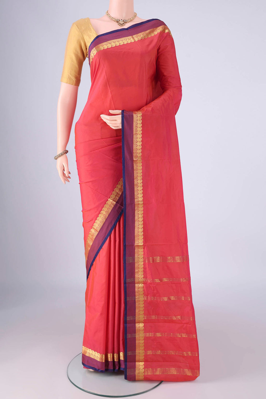Coral Blended Bangalore Silk Saree with Plain Body and Zari Border.  displayed on a mannequin