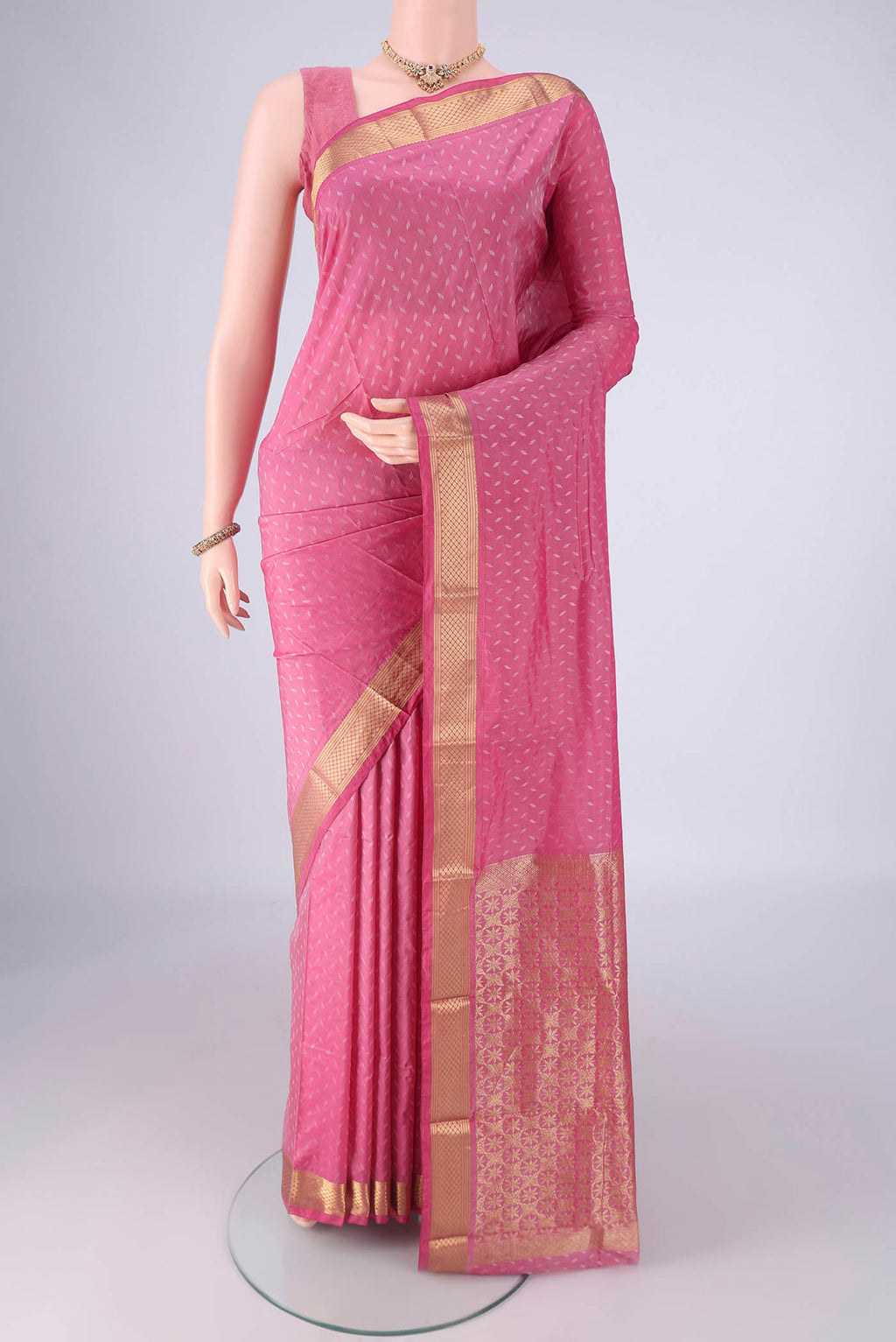 Rose pink Blended Bangalore Silk Saree with Jacquard design on the body and Zari Border.  displayed on a mannequin
