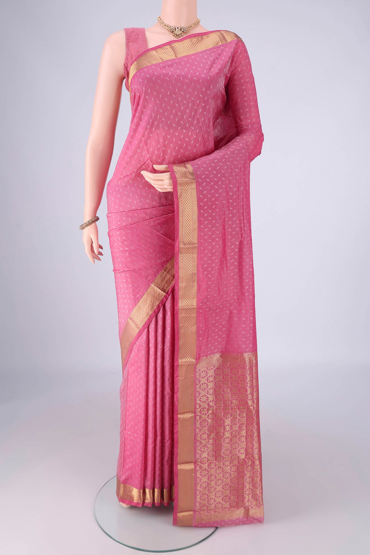 Rose pink Blended Bangalore Silk Saree with Jacquard design on the body and Zari Border.  displayed on a mannequin
