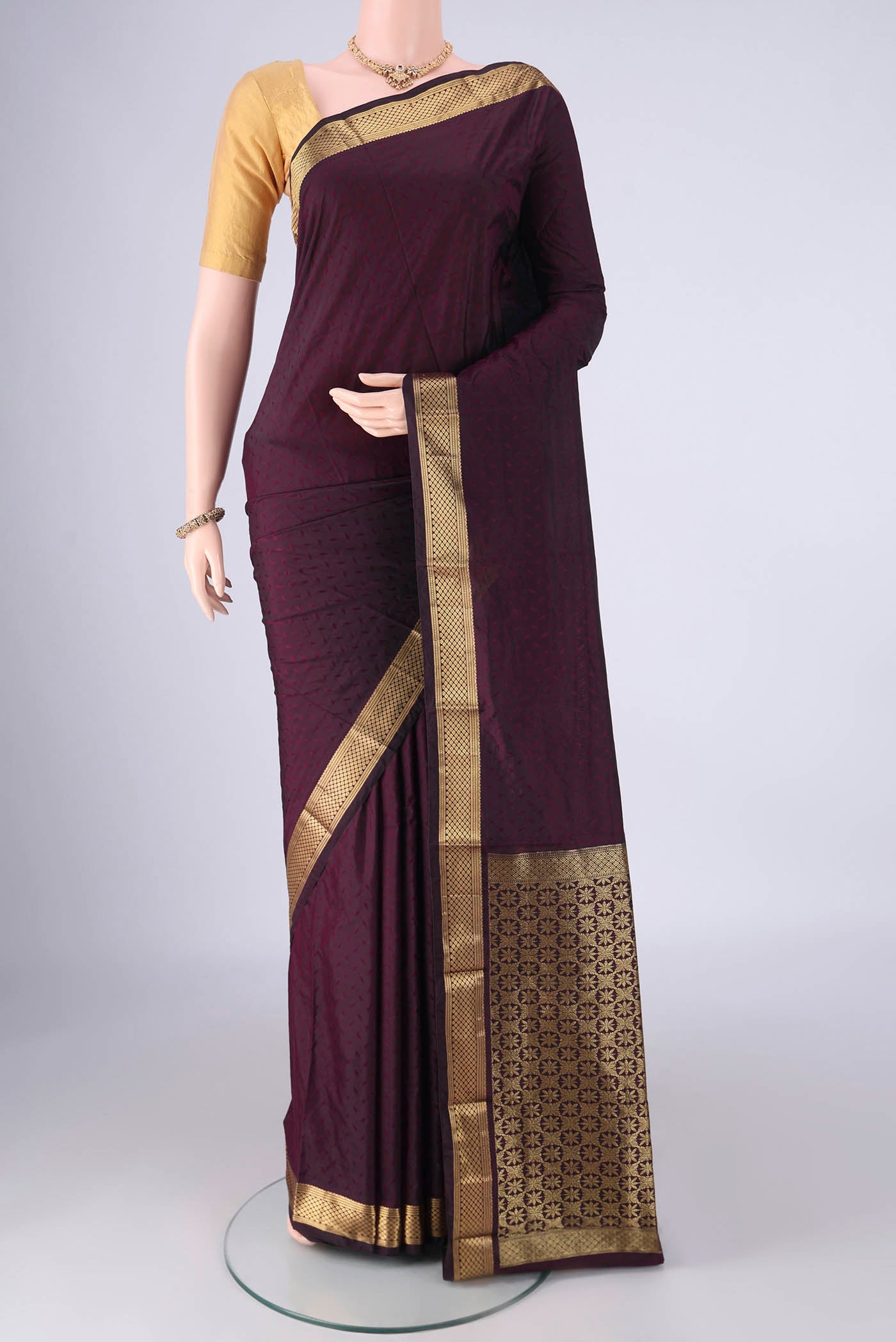 Purple Blended Bangalore Silk Saree with Jacquard design on the body and Zari Border.  displayed on a mannequin