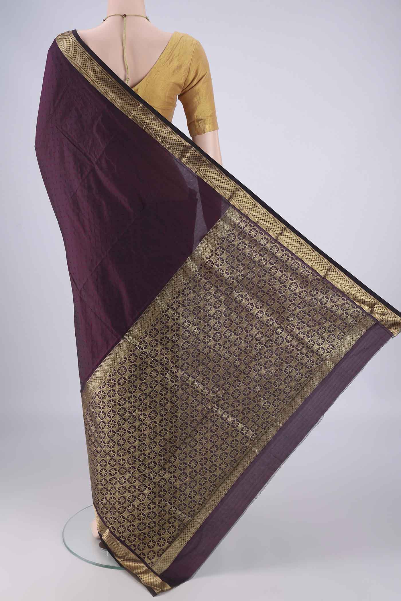 Flat view of Purple Blended Bangalore Silk Saree with Jacquard design on the body and Zari Border. 