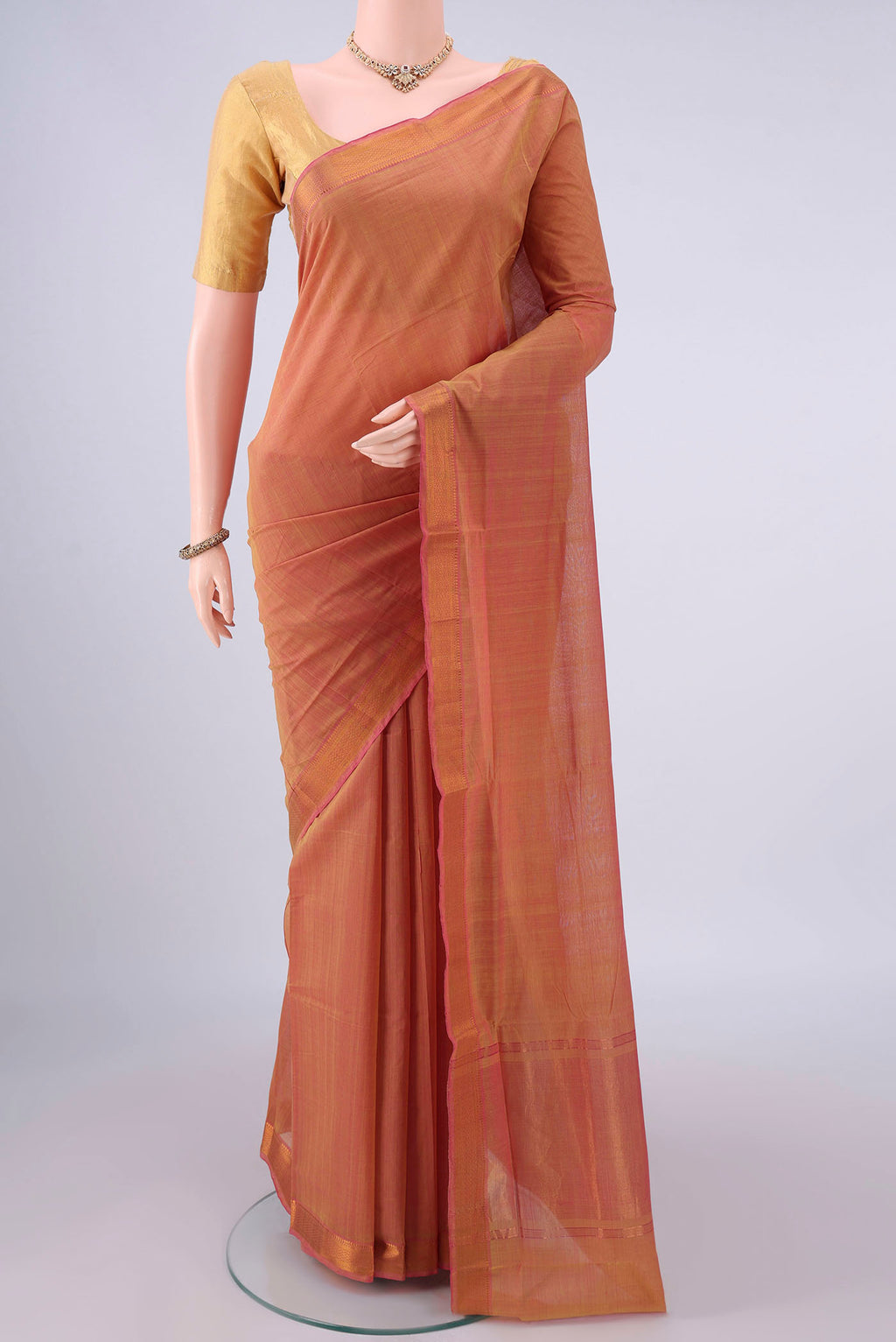 Peach Mangalagiri Cotton Saree with Plain Body and Zari Border.  displayed on a mannequin