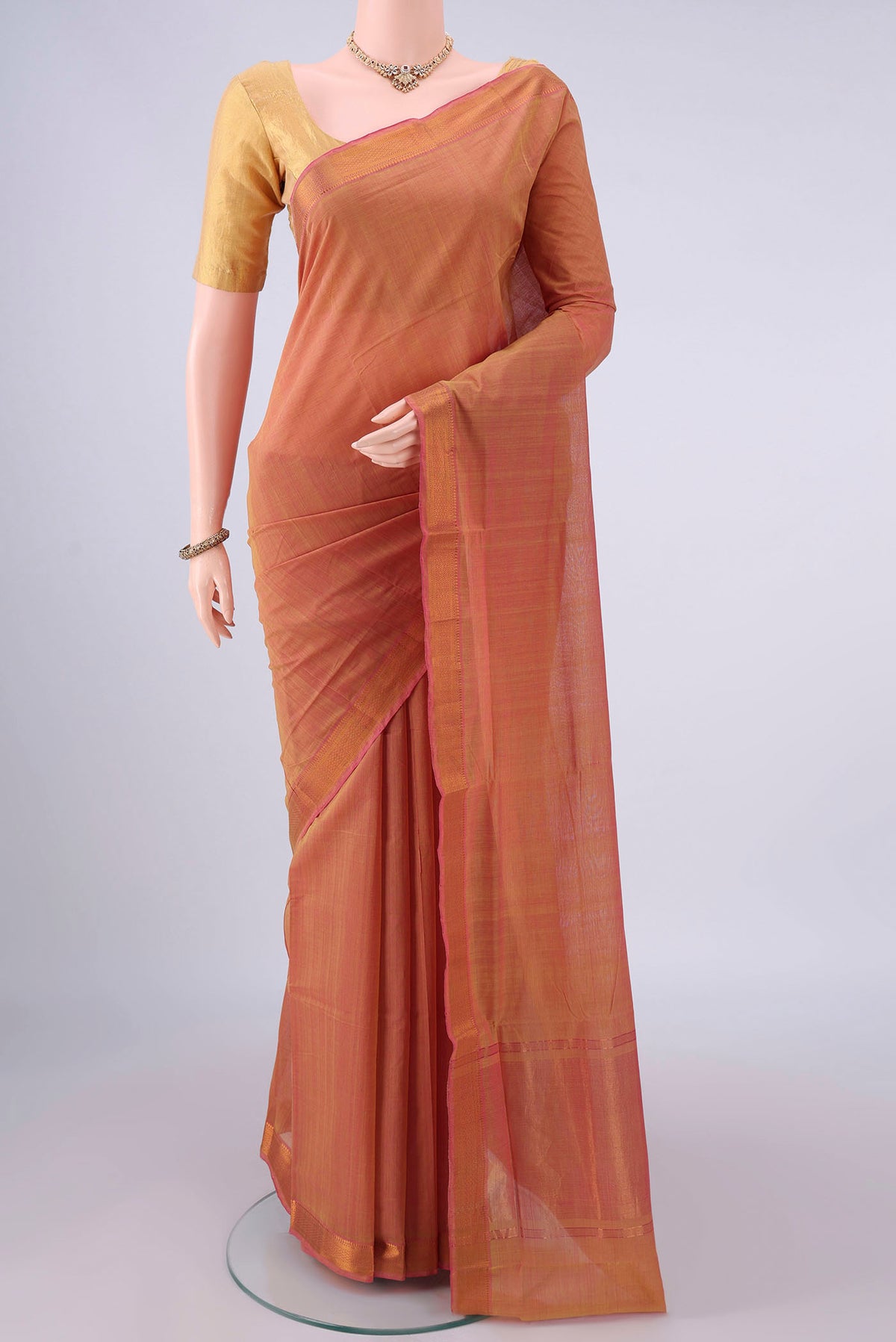 Peach Mangalagiri Cotton Saree with Plain Body and Zari Border.  displayed on a mannequin