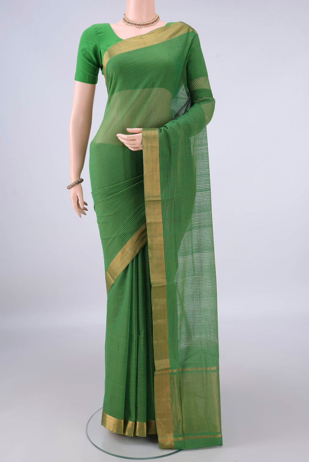 Green Mangalagiri Cotton Saree with Stripes on the body and Zari Border.  displayed on a mannequin