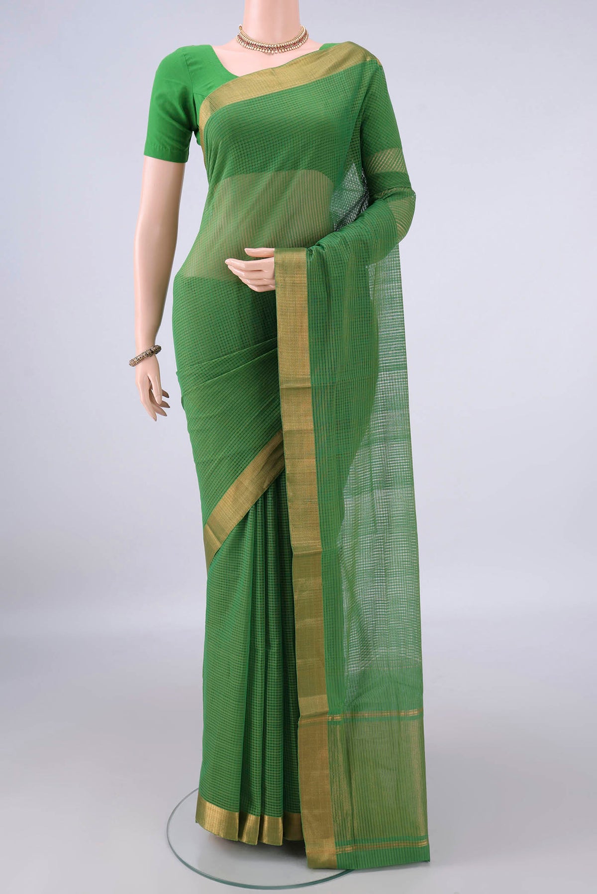 Green Mangalagiri Cotton Saree with Stripes on the body and Zari Border.  displayed on a mannequin