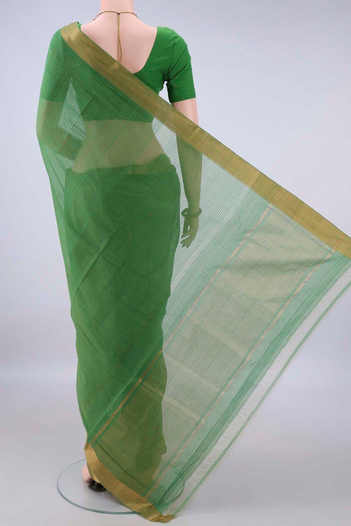 Flat view of Green Mangalagiri Cotton Saree with Stripes on the body and Zari Border. 