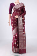 Pure Silk Burgundy Banarasi Raw Saree with Zari Butta on the body and Zari Border.  displayed on a mannequin