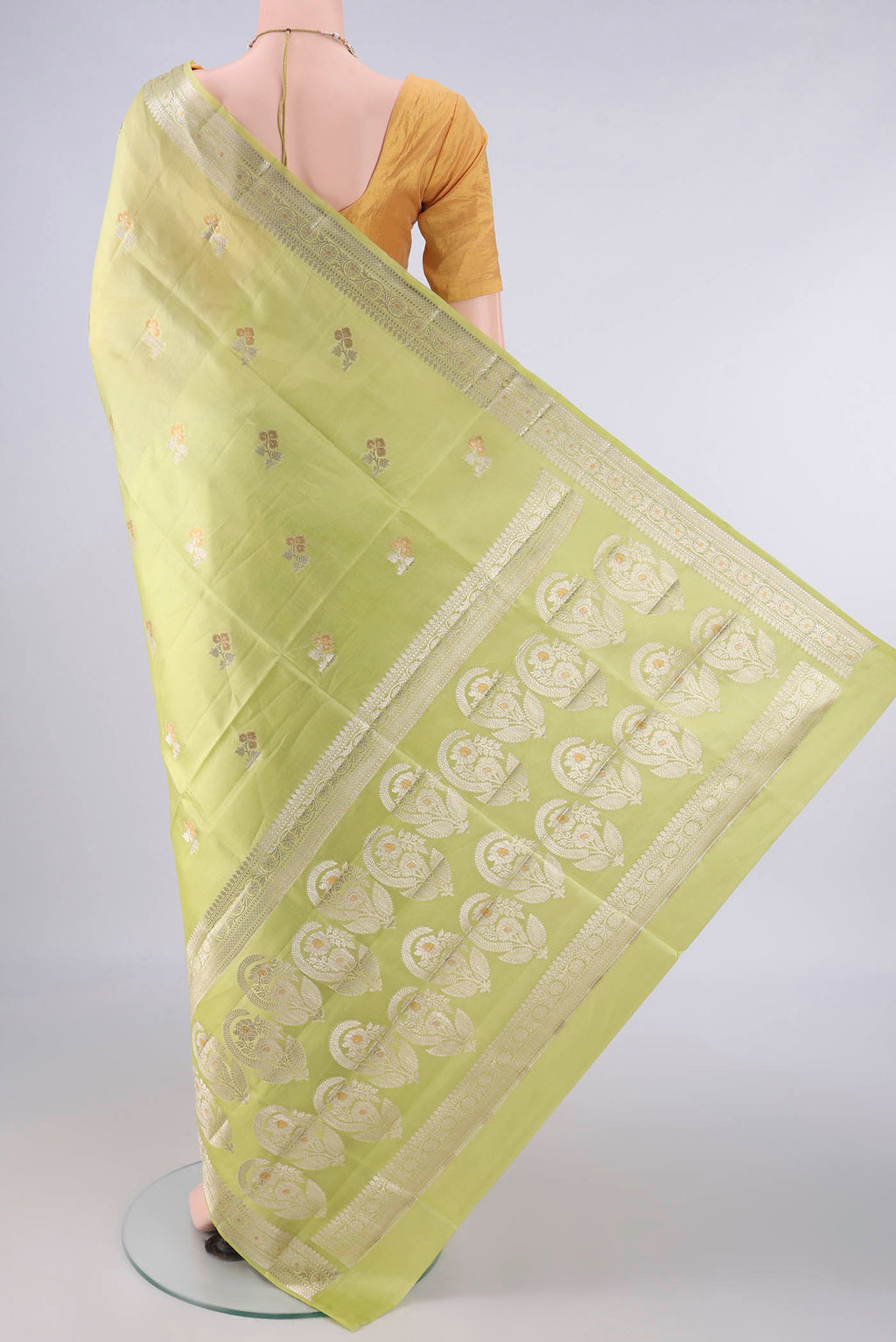 Flat view of Pure Silk Acid Green Banarasi Raw Saree with Zari And Thread Butta on the body and Zari Border. 