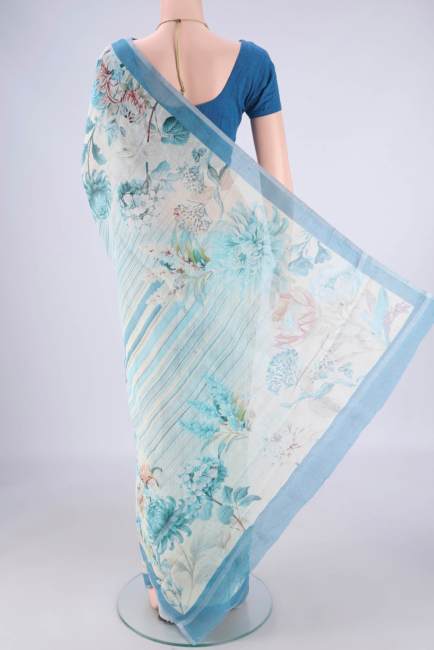 Flat view of Off White Linen Saree with Geometric Print on the body and Zari Border. 