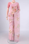 Rani Pink Linen Saree with Floral Print on the body and Zari Border.  displayed on a mannequin