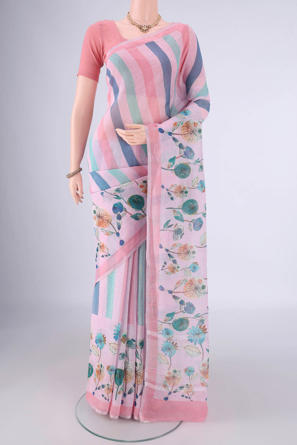 Multi Color Linen Saree with Geometric Print on the body and Zari Border.  displayed on a mannequin
