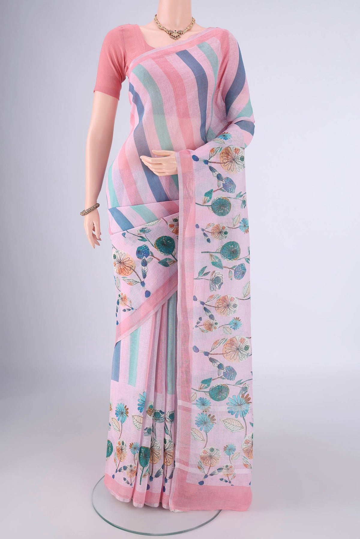 Multi Color Linen Saree with Geometric Print on the body and Zari Border.  displayed on a mannequin