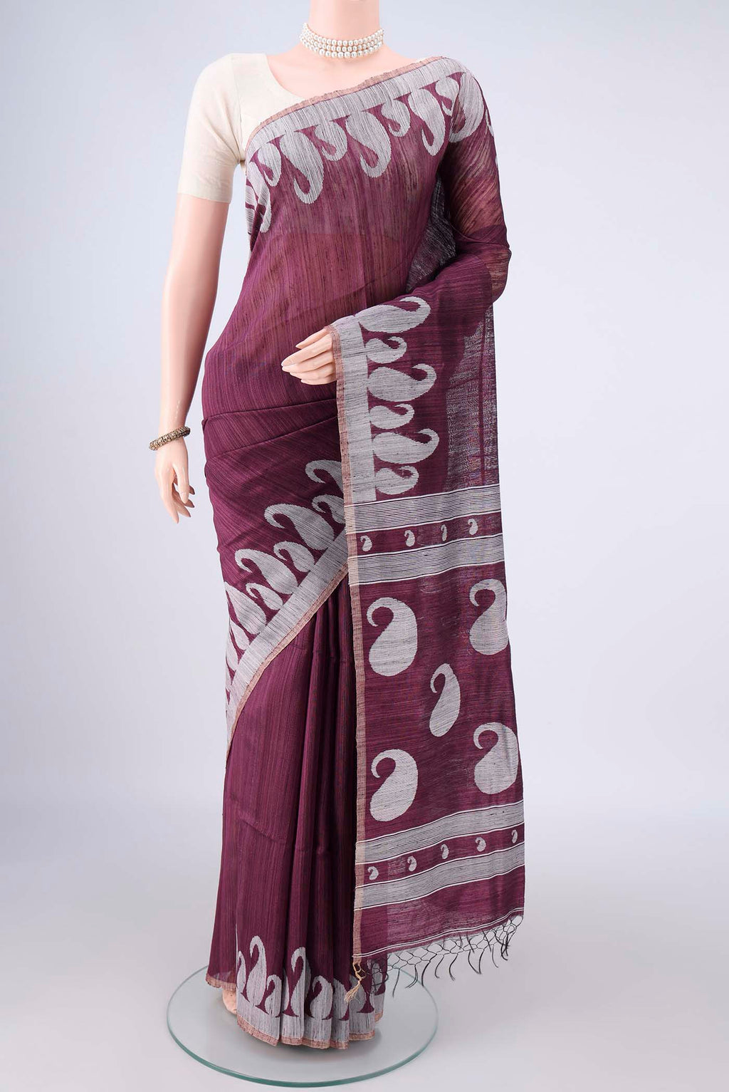 Pure Silk Burgundy Jute Saree with Jamdani on the body and Fancy Border.  displayed on a mannequin
