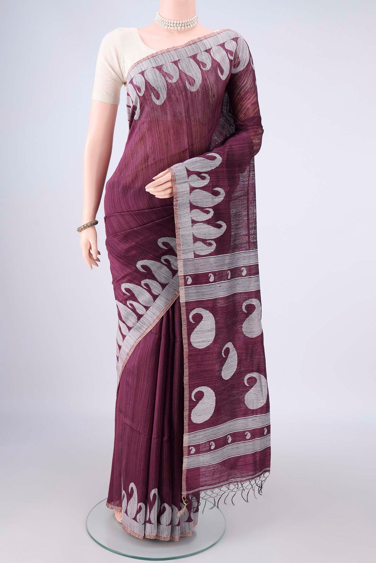 Pure Silk Burgundy Jute Saree with Jamdani on the body and Fancy Border.  displayed on a mannequin