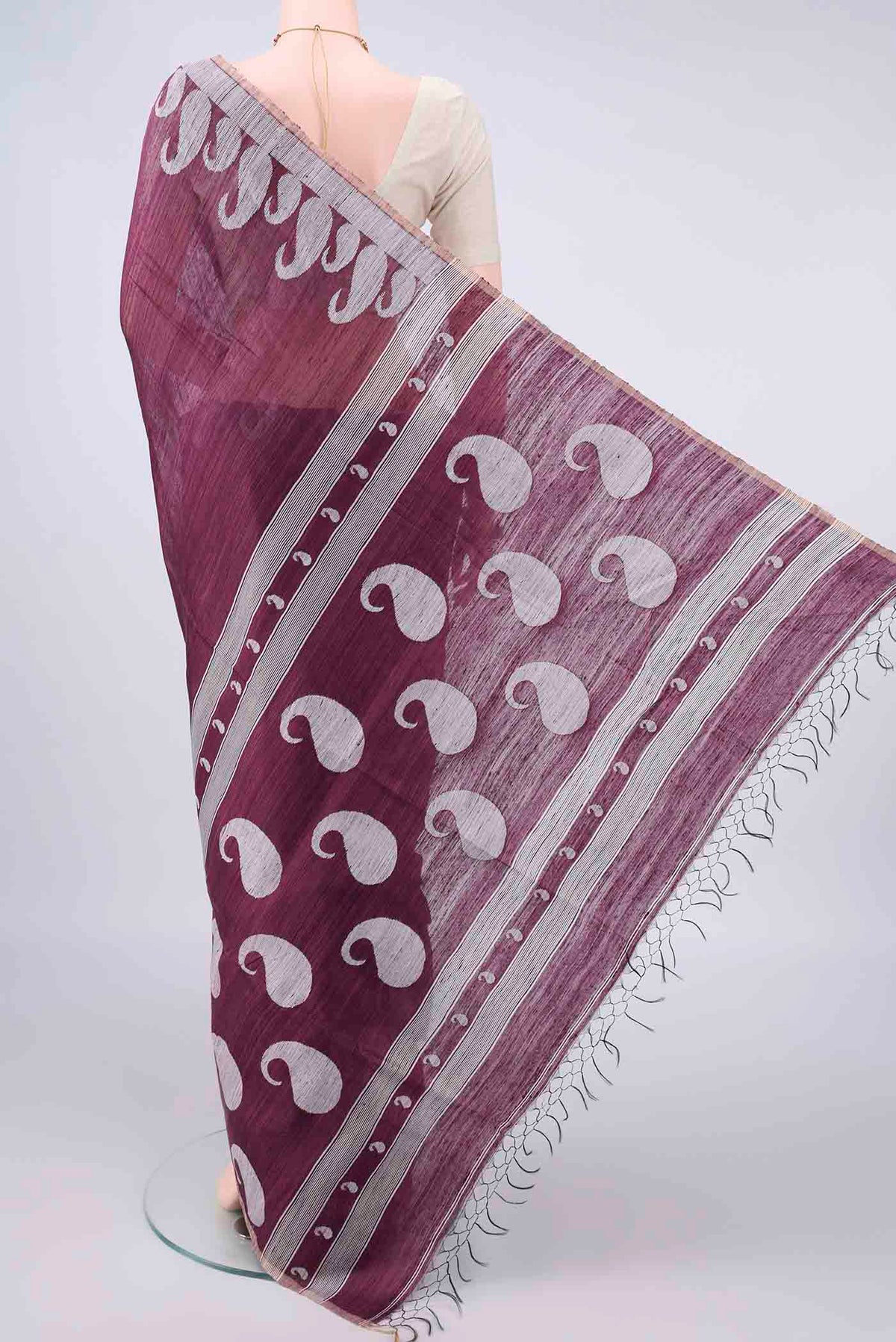 Flat view of Pure Silk Burgundy Jute Saree with Jamdani on the body and Fancy Border. 