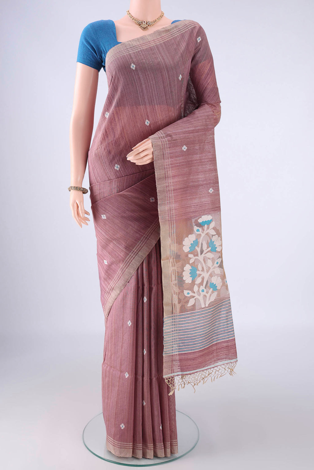 Mauve Jute Silk Saree with Thread Butta on the body and Plain Border.  displayed on a mannequin