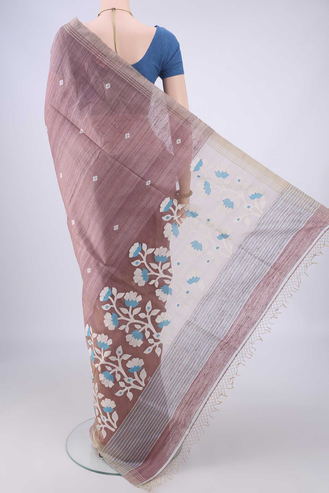 Flat view of Mauve Jute Silk Saree with Thread Butta on the body and Plain Border. 