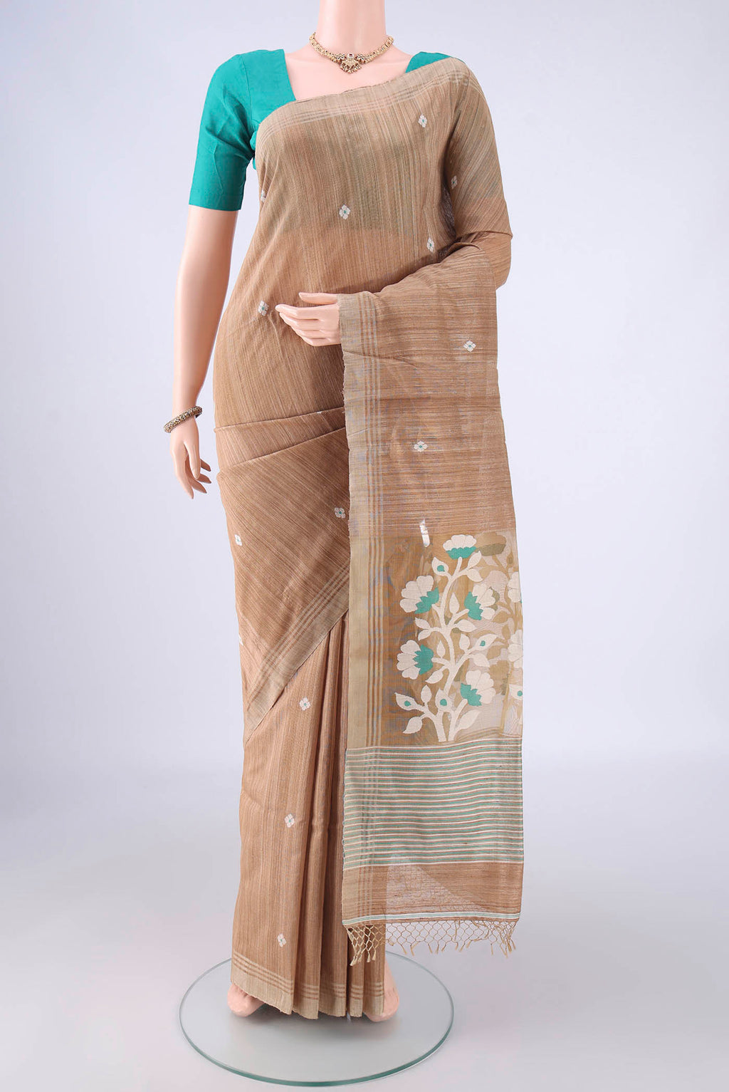Dark Beige Jute Silk Saree with Plain Body and Plain Border.  displayed on a mannequin