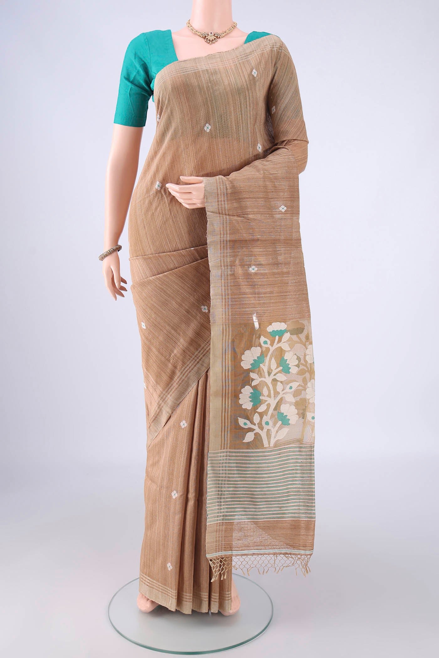 Dark Beige Jute Silk Saree with Plain Body and Plain Border.  displayed on a mannequin