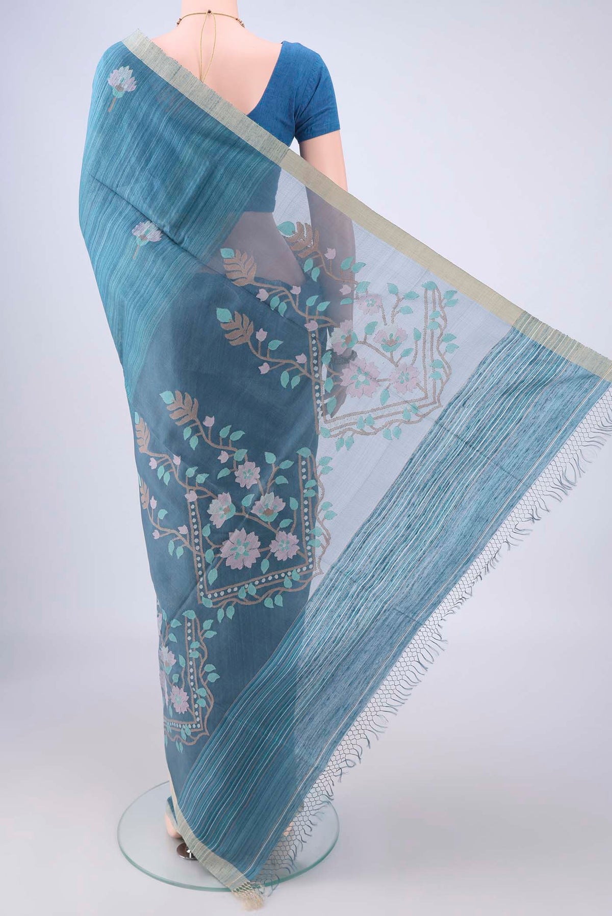 Flat view of Blue Jute Silk Saree with Jamdani on the body and Thread Border. 