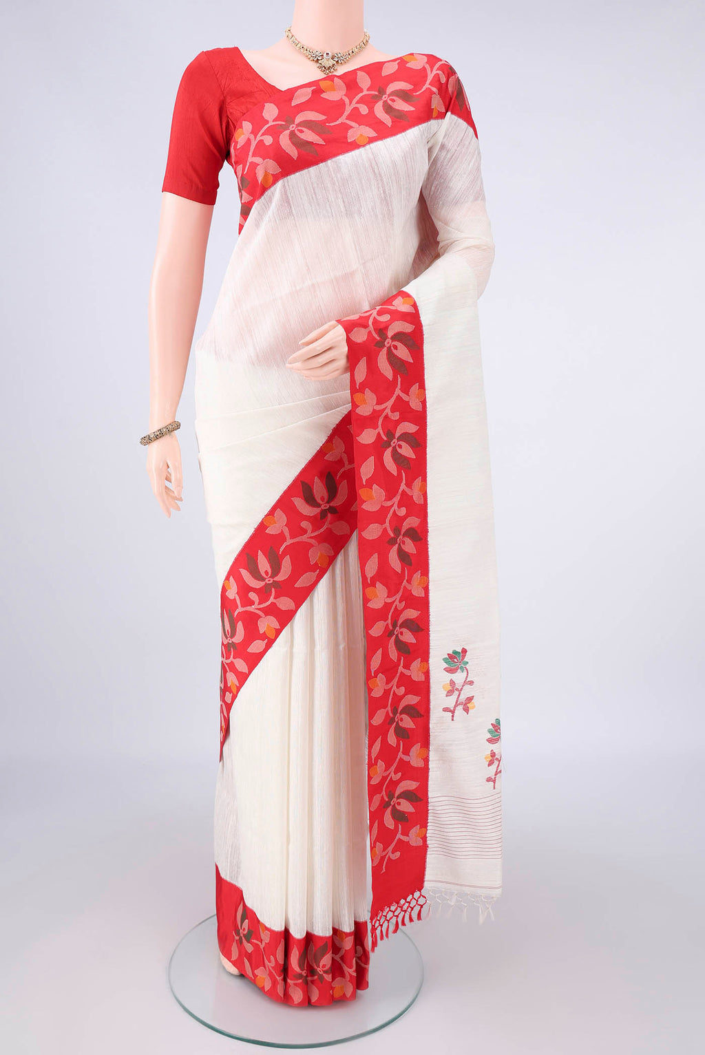 Pure Silk Pearl White Jute Saree with Jamdani on the body and Fancy Border.  displayed on a mannequin