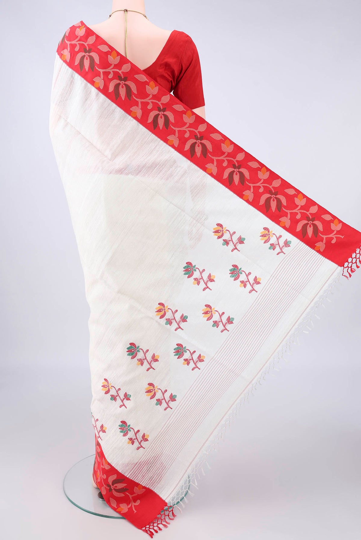 Flat view of Pure Silk Pearl White Jute Saree with Jamdani on the body and Fancy Border. 