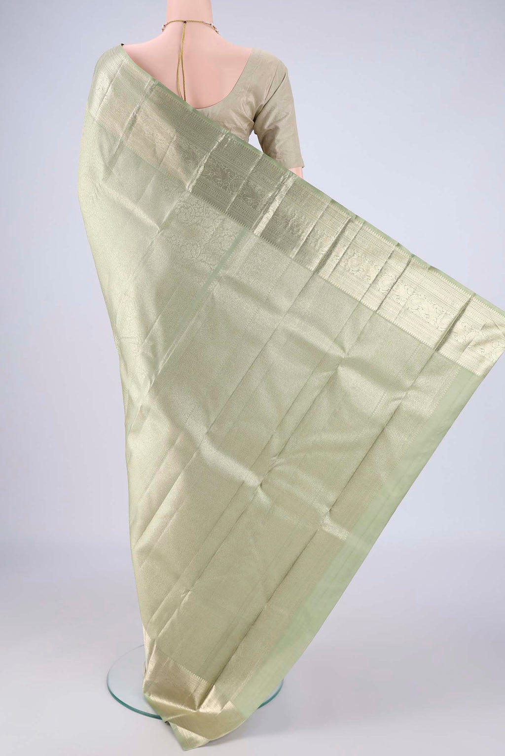 Flat view of Sage Green Kanchipuram Silk Saree with Zari Brocade on the body and Zari Border. 