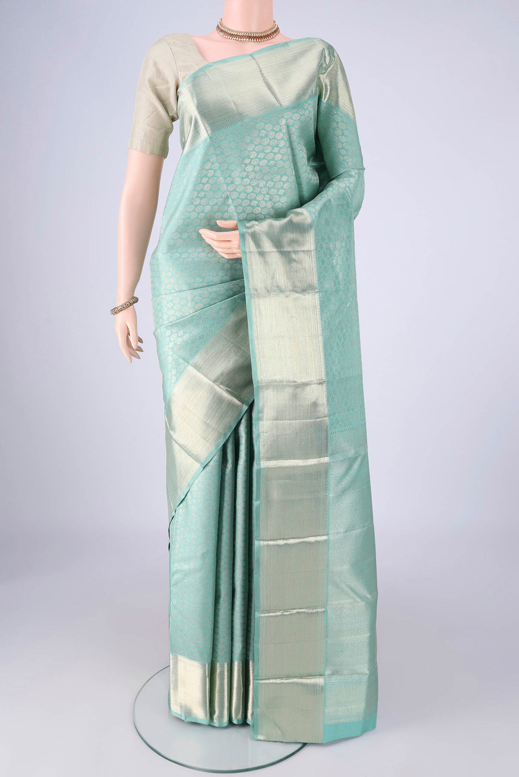 Light Blue Kanchipuram Silk Saree with Zari Brocade on the body and Zari Border.  displayed on a mannequin