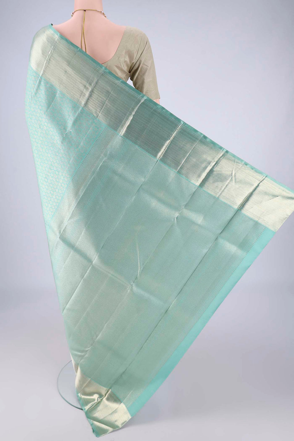 Flat view of Light Blue Kanchipuram Silk Saree with Zari Brocade on the body and Zari Border. 