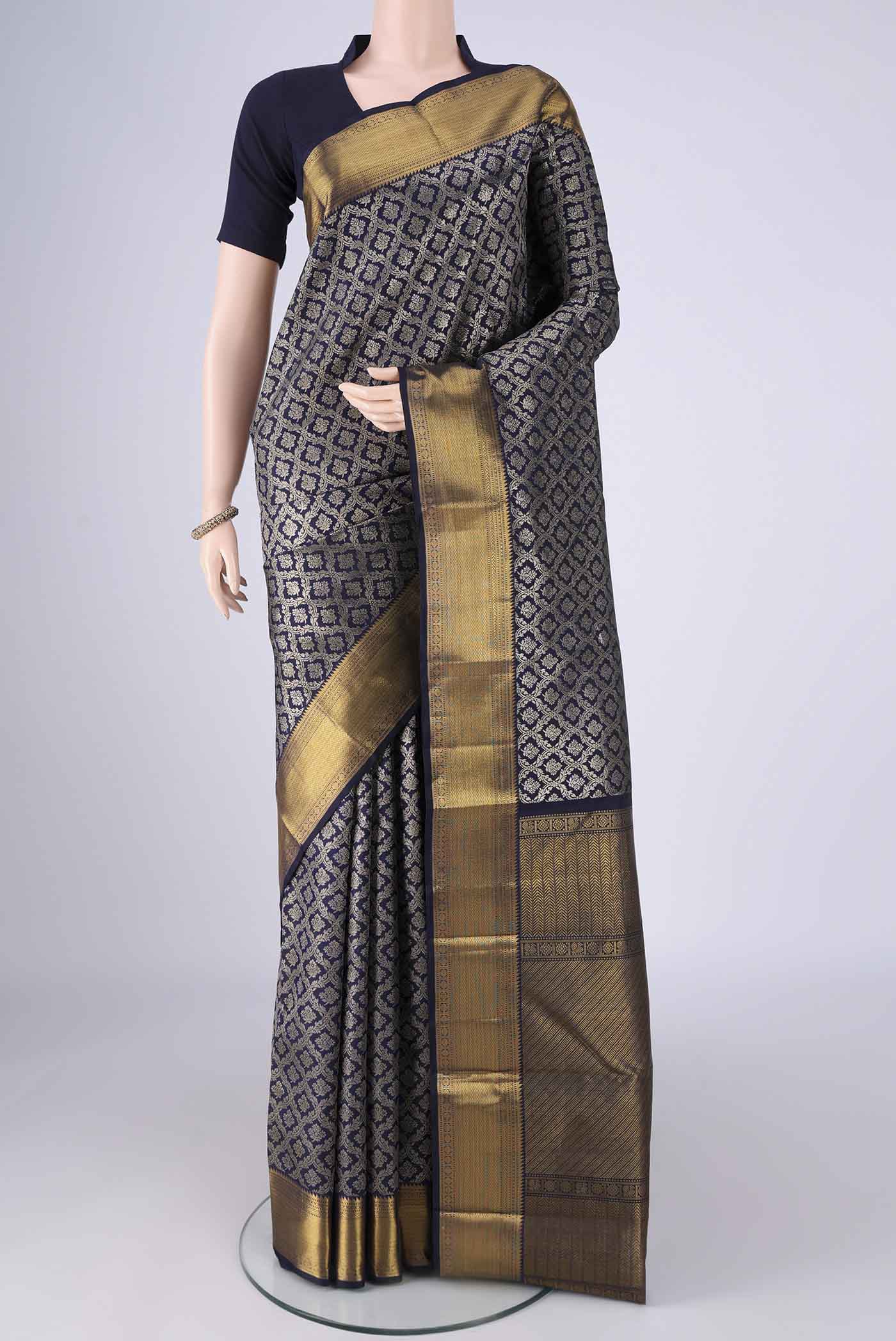 Navy Blue Kanchipuram Silk Saree with Zari Brocade on the body and Zari Border.  displayed on a mannequin
