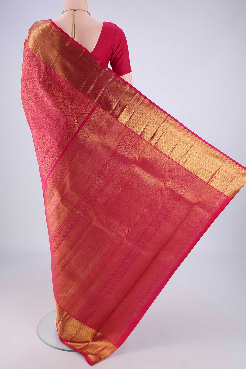 Flat view of Pink Kanchipuram Silk Saree with Zari Brocade on the body and Zari Border. 