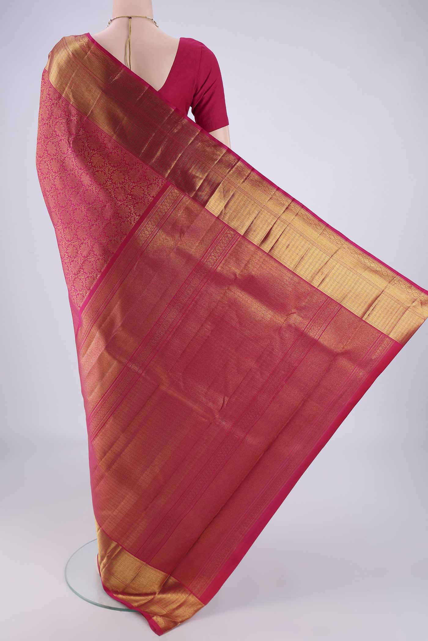 Flat view of Pink Kanchipuram Silk Saree with Zari Brocade on the body and Zari Border. 