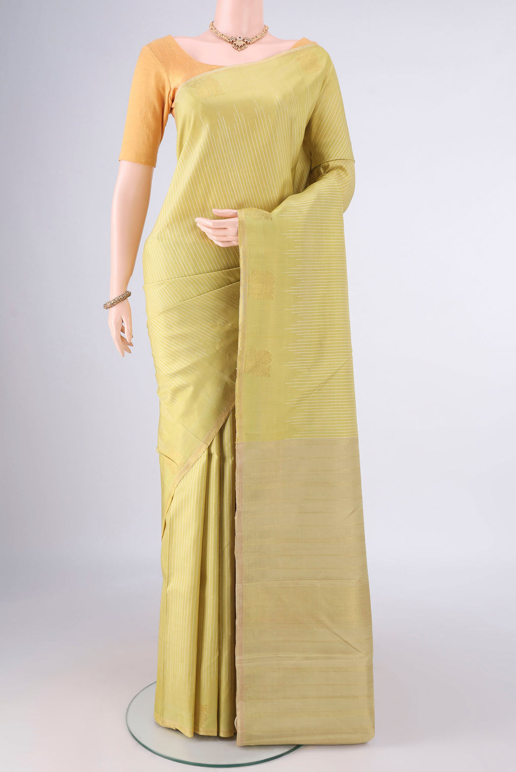 Pure Silk Pure Zari Sandal Kanchipuram Saree with Stripes on the body and Without Border.  displayed on a mannequin