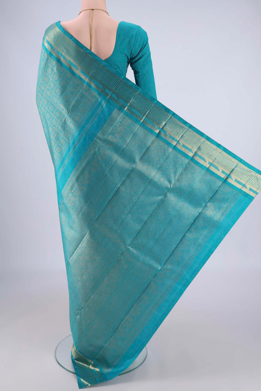 Flat view of Pure Silk Pure Zari Sea Green Kanjivaram Saree with Zari Brocade on the body and Zari Border. 