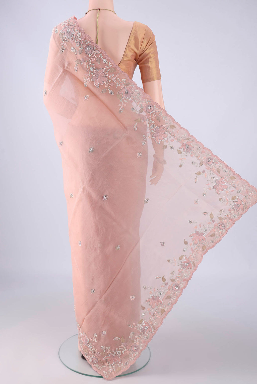 Flat view of Rose Gold Organza Silk Saree with Embroidery on the body and Embroidery Border. 
