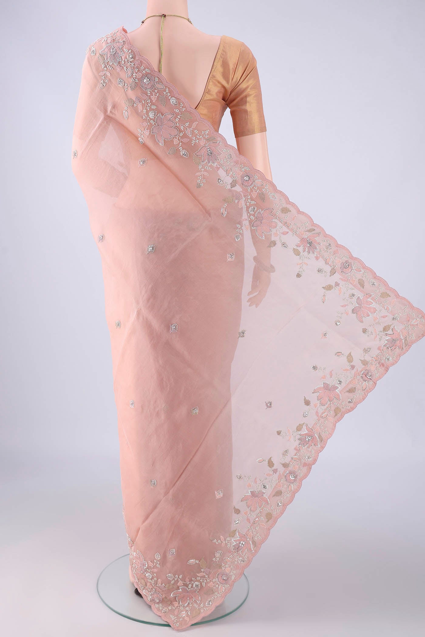 Flat view of Rose Gold Organza Silk Saree with Embroidery on the body and Embroidery Border. 