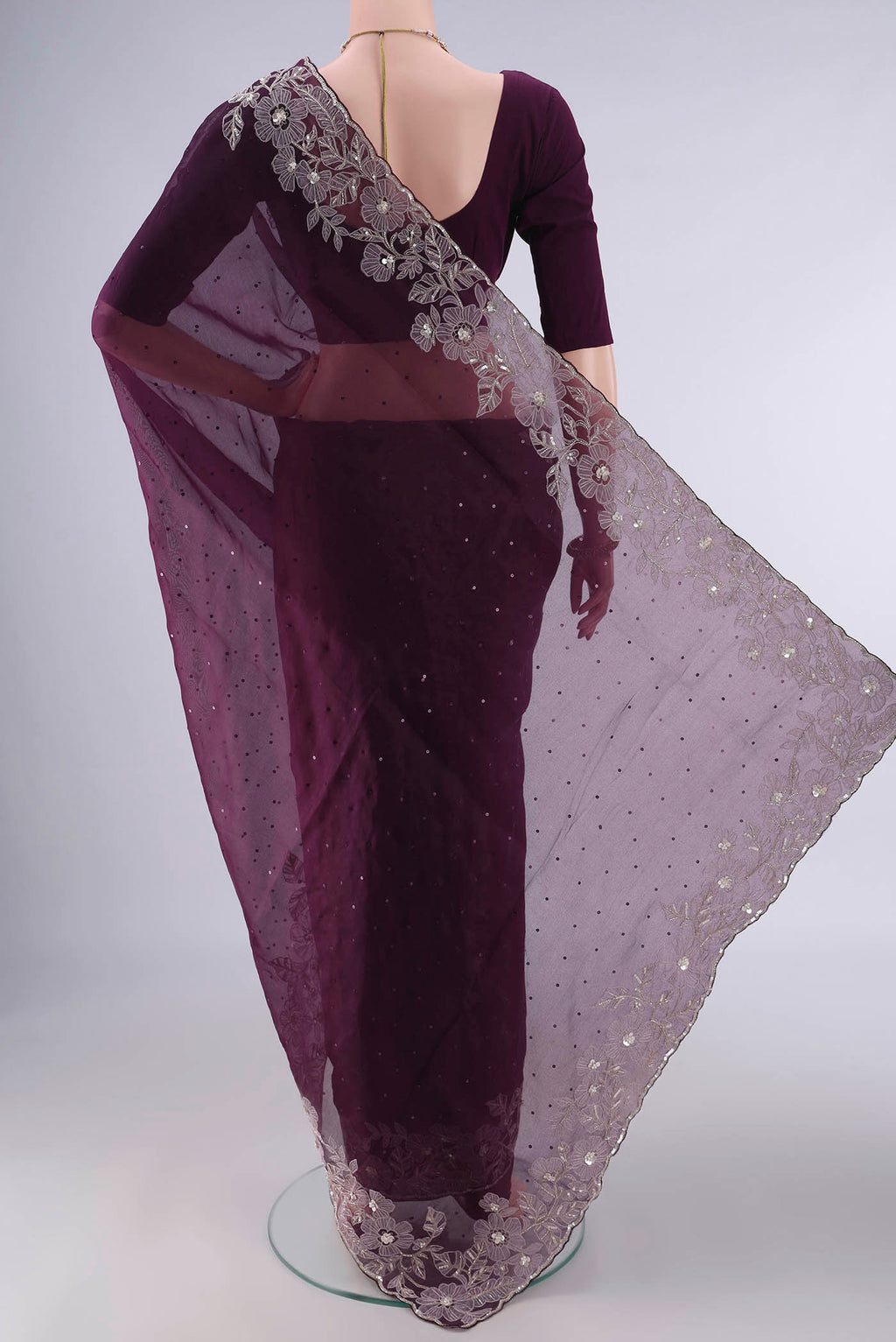 Flat view of Burgundy Organza Saree with Embroidery on the body and Embroidery Border. 