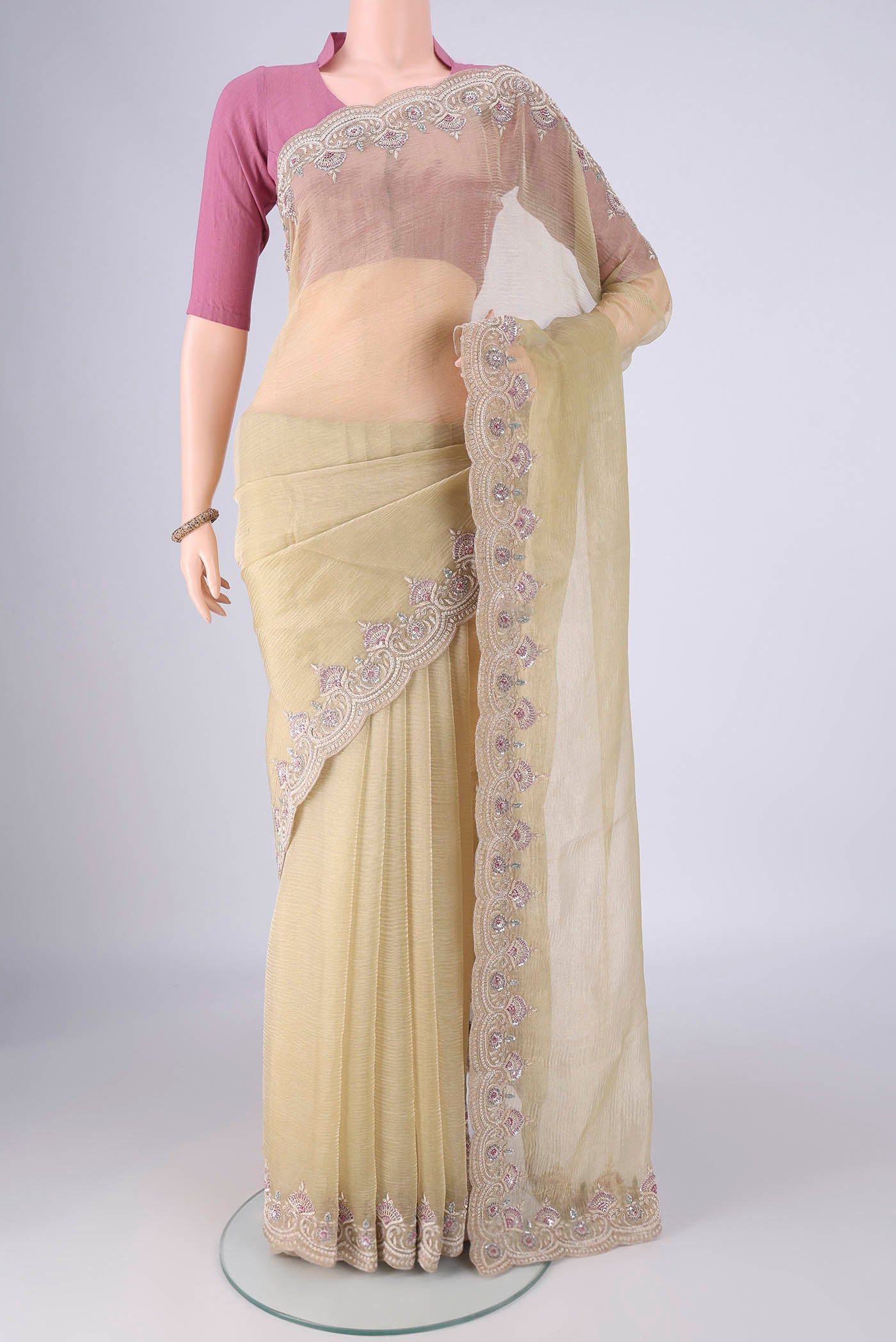 Pista Green Kanchipuram Silk Saree with Embroidery on the body and Embroidery Border.  displayed on a mannequin