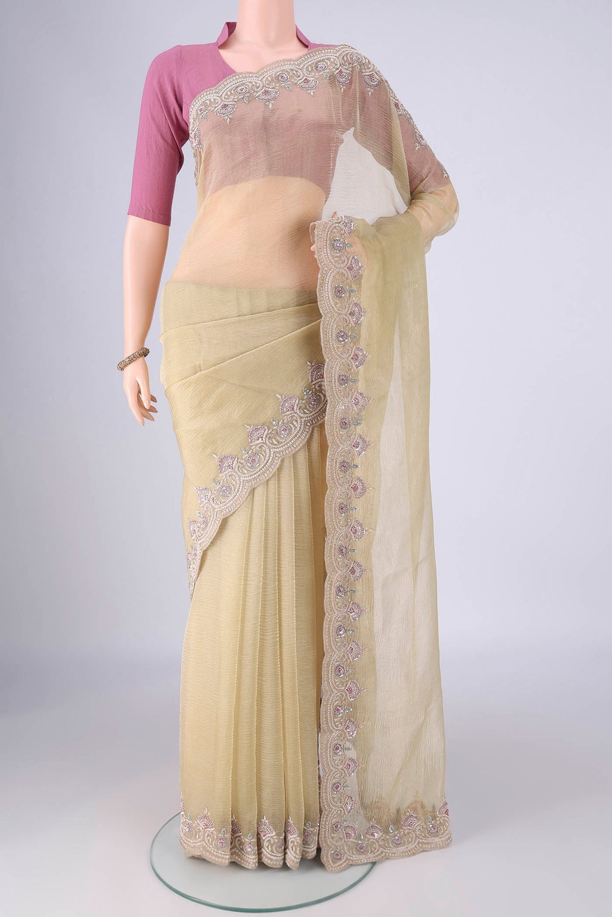 Pista Green Kanchipuram Silk Saree with Embroidery on the body and Embroidery Border.  displayed on a mannequin