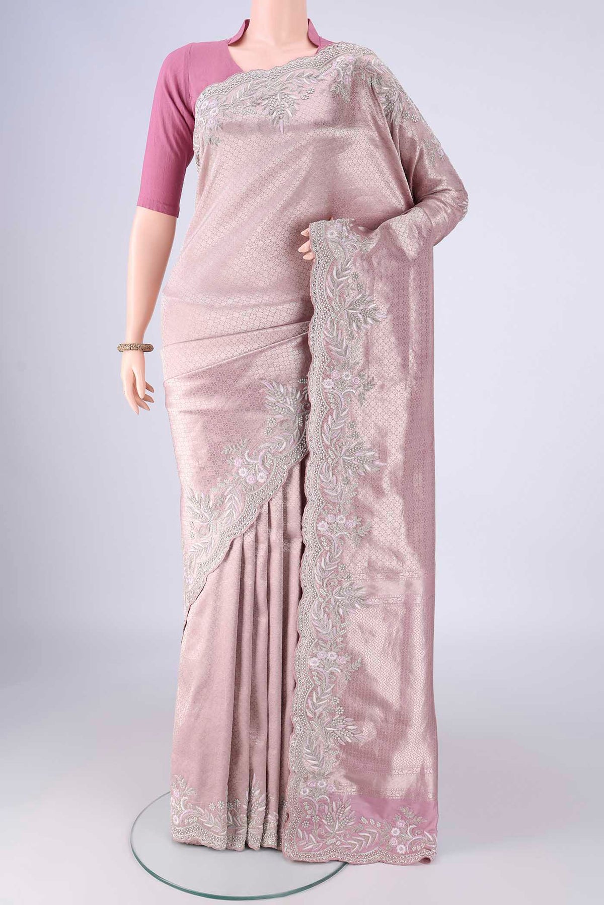 Rose pink Banarasi Silk Saree with Zari Brocade on the body and Embroidery Border.  displayed on a mannequin