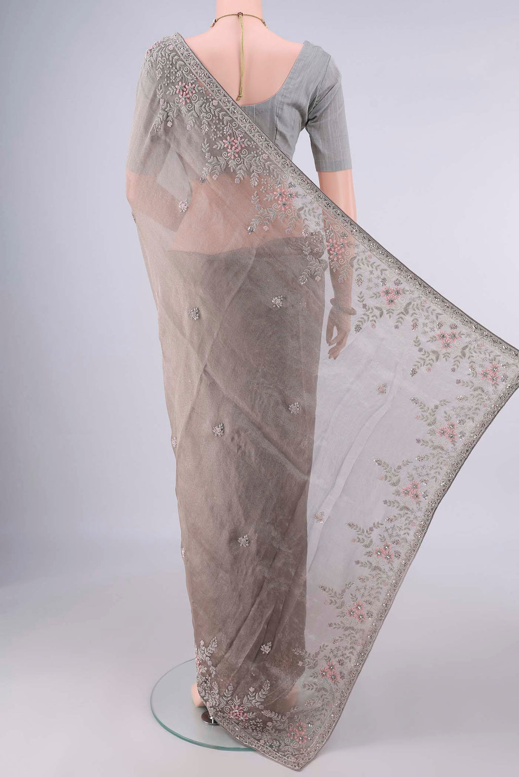 Flat view of Davys Grey Organza Saree with Embroidery on the body and Embroidery Border. 