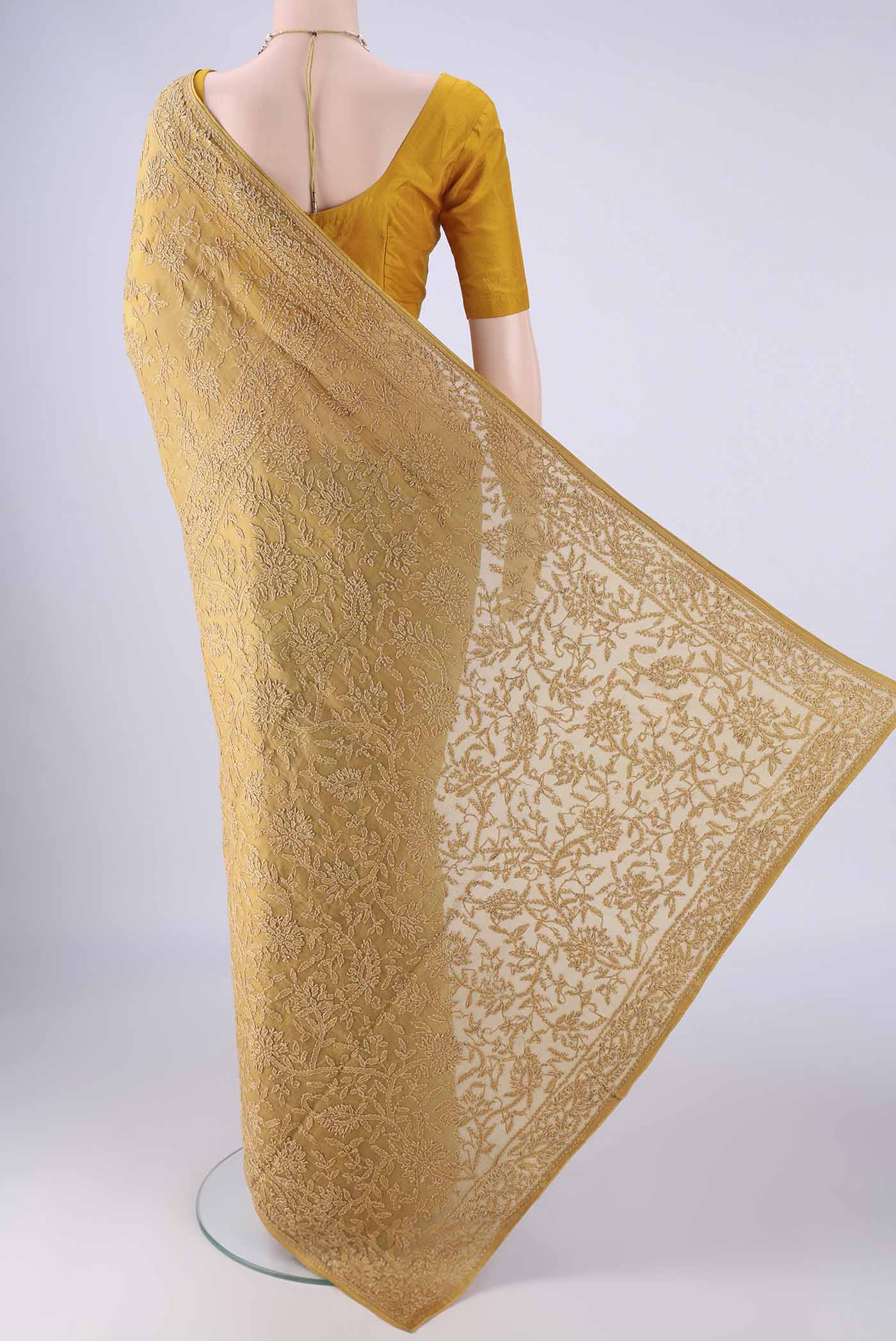 Flat view of Mustard Organza Silk Saree with Embroidery on the body and Embroidery Border. 