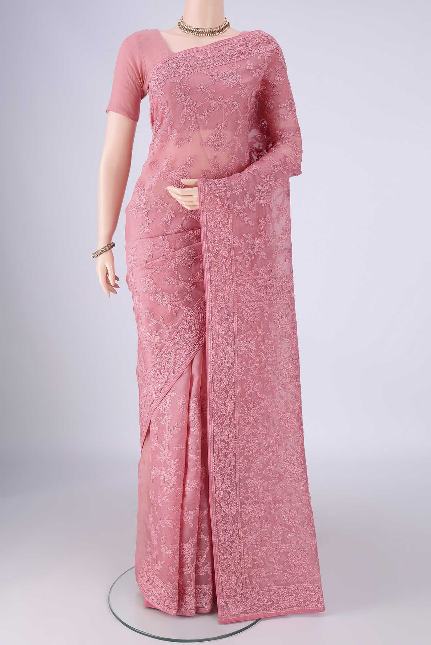 Pink Organza Silk Saree with Embroidery on the body and Embroidery Border.  displayed on a mannequin