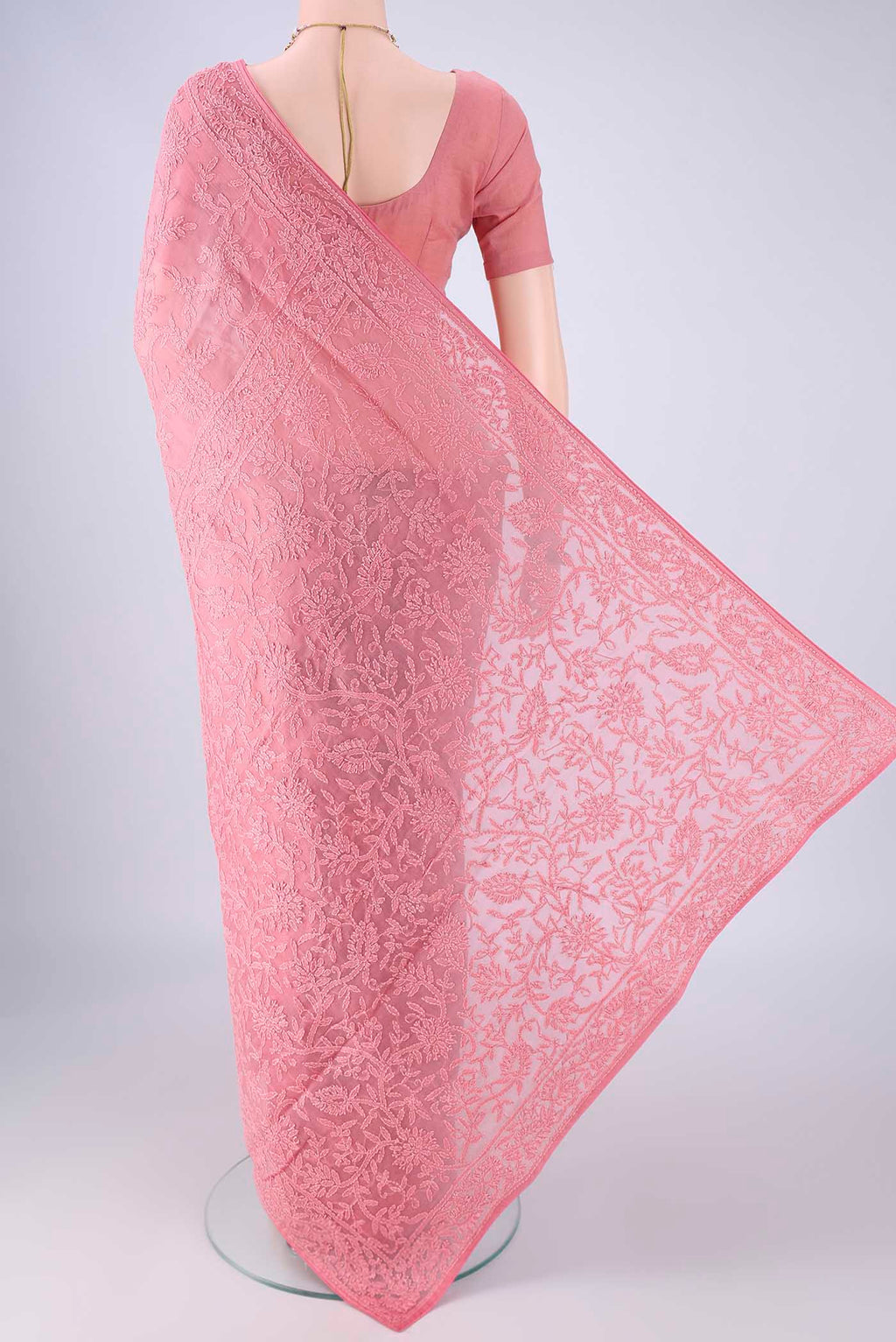 Flat view of Pink Organza Silk Saree with Embroidery on the body and Embroidery Border. 