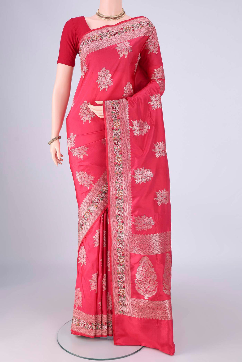 Imperial Pink Banarasi Silk Saree with Zari Butta on the body and Zari Border.  displayed on a mannequin