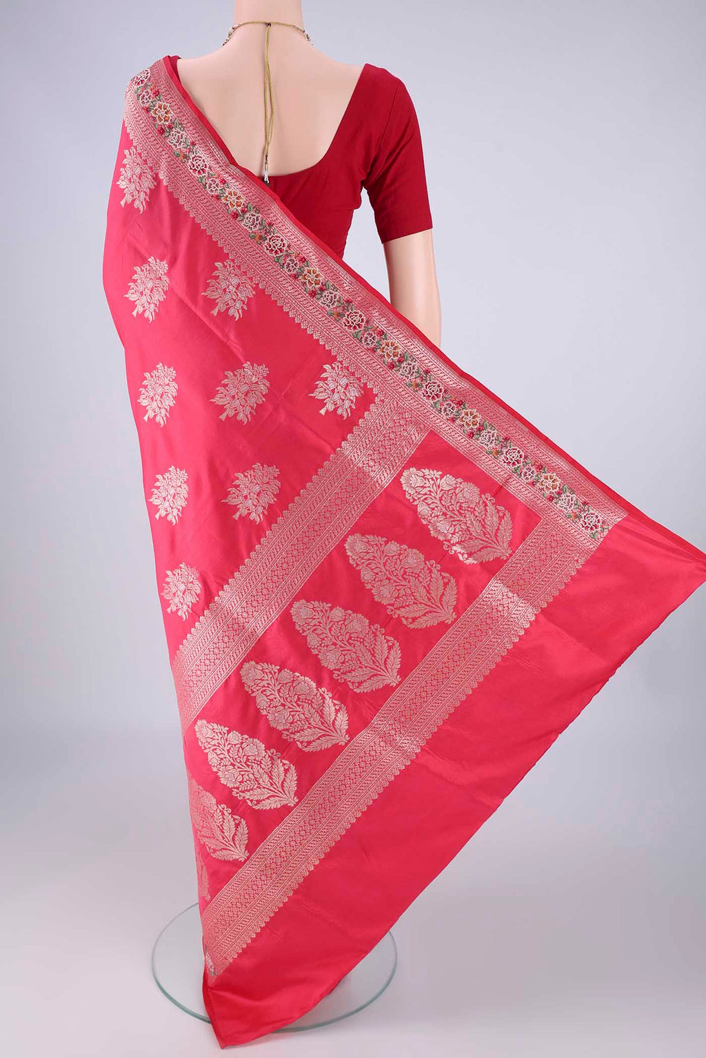 Flat view of Imperial Pink Banarasi Silk Saree with Zari Butta on the body and Zari Border. 