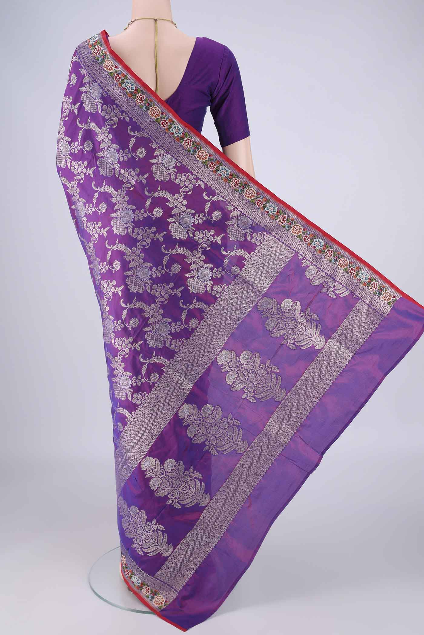 Flat view of Purple Banarasi Silk Saree with Zari Brocade on the body and Zari Border. 
