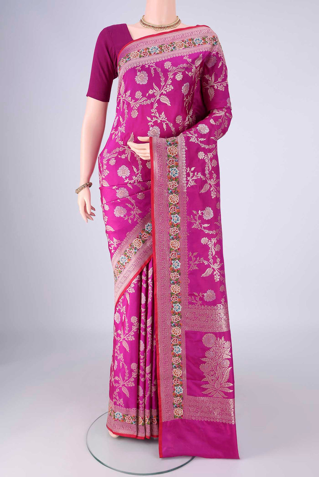 Purple Banarasi Silk Saree with Zari Butta on the body and Zari Border.  displayed on a mannequin