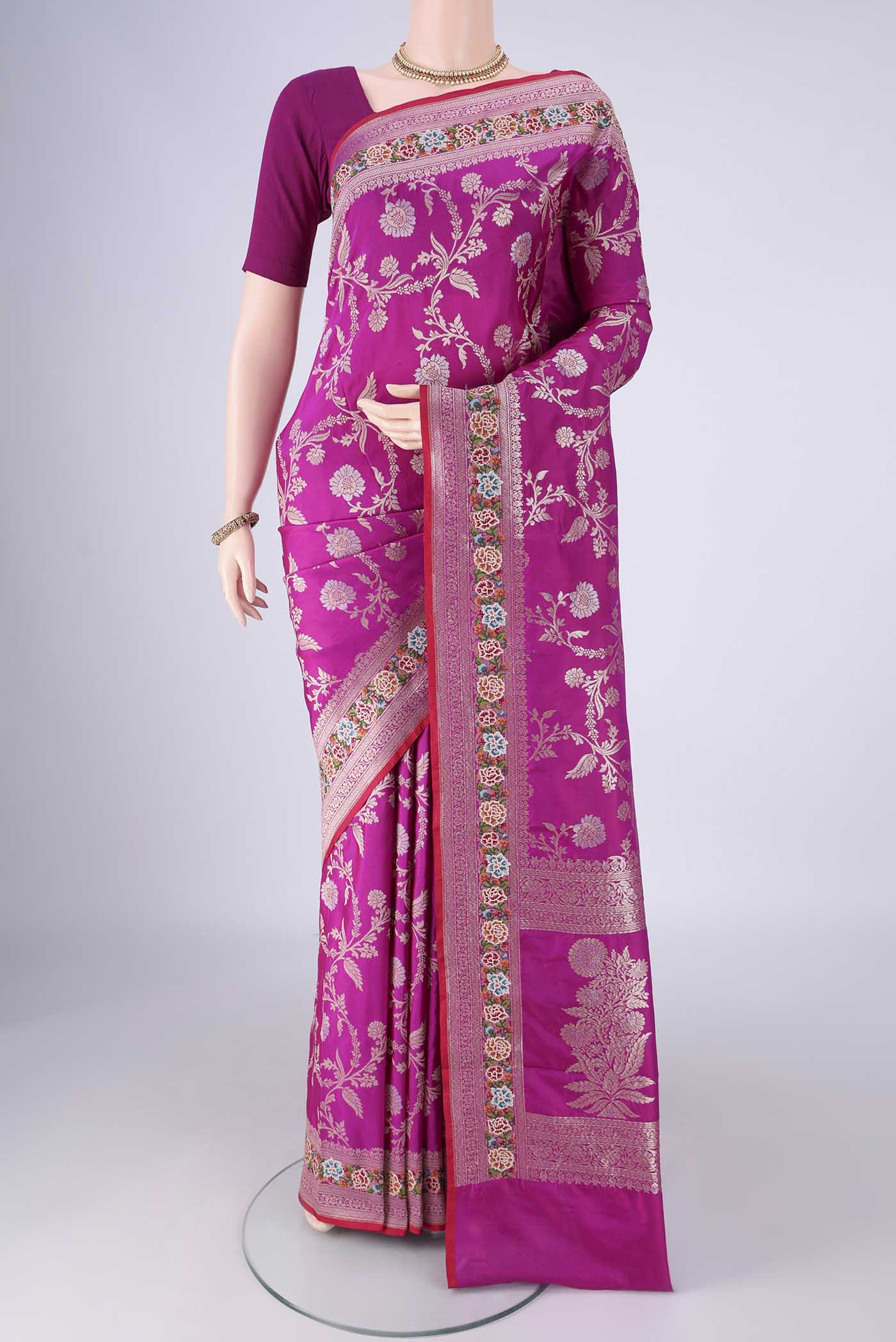 Purple Banarasi Silk Saree with Zari Butta on the body and Zari Border.  displayed on a mannequin